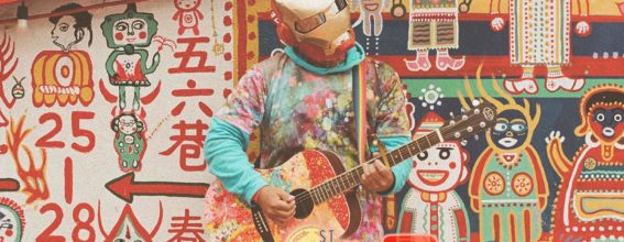 guy-playing-guitar-with-background-graffiti